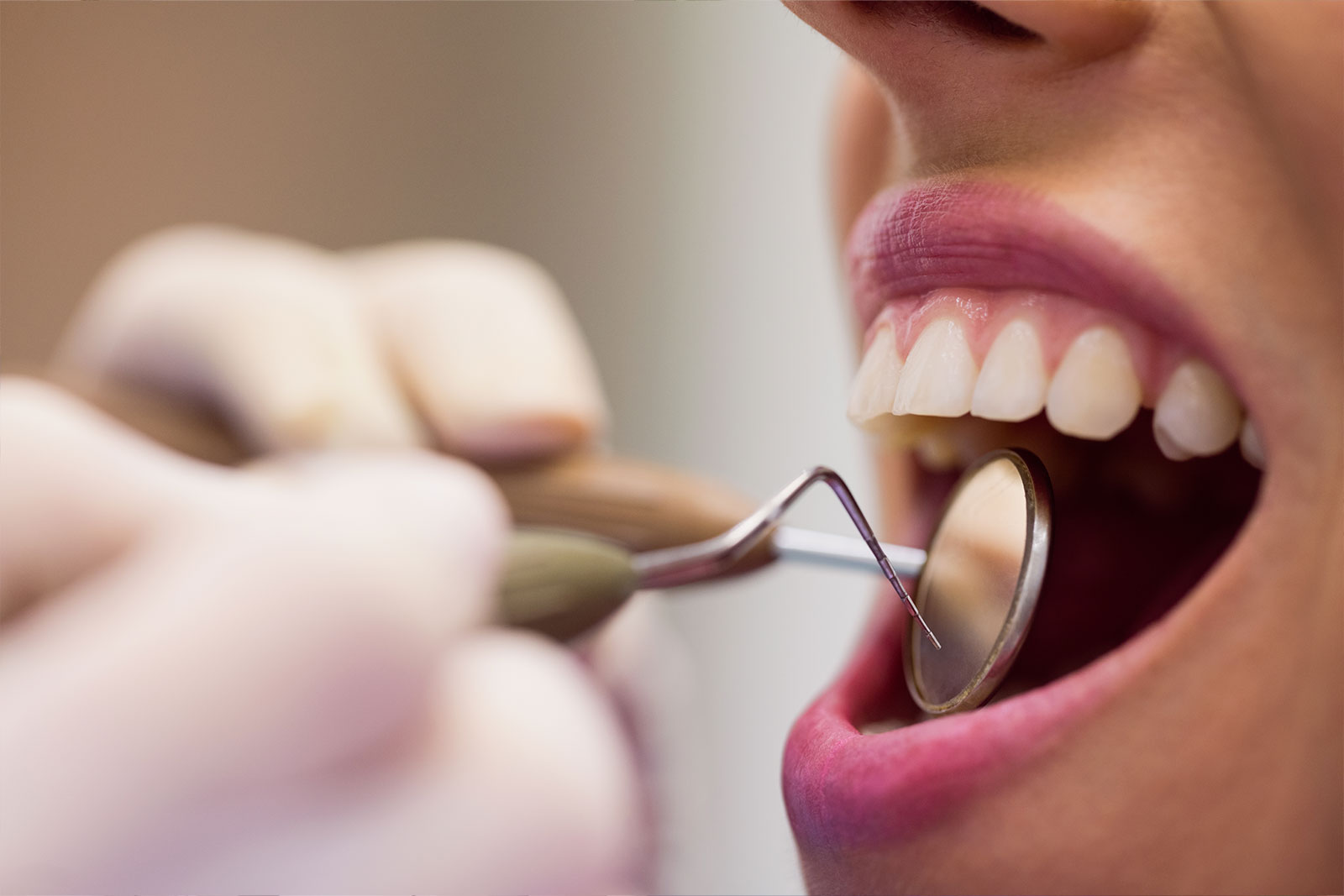 Dental professional working with a patient during a clinical appointment
